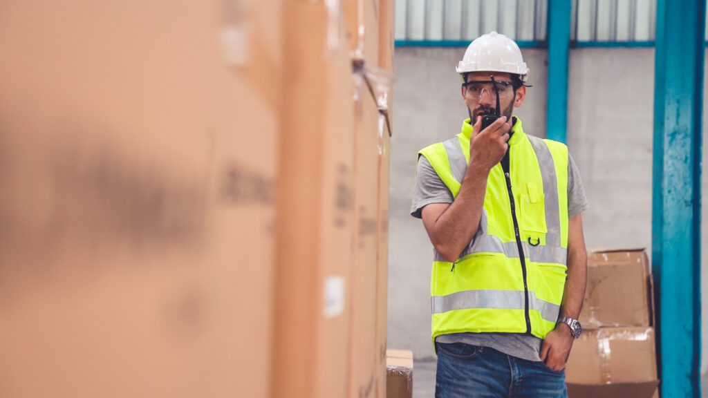 Technician using radio to communicate